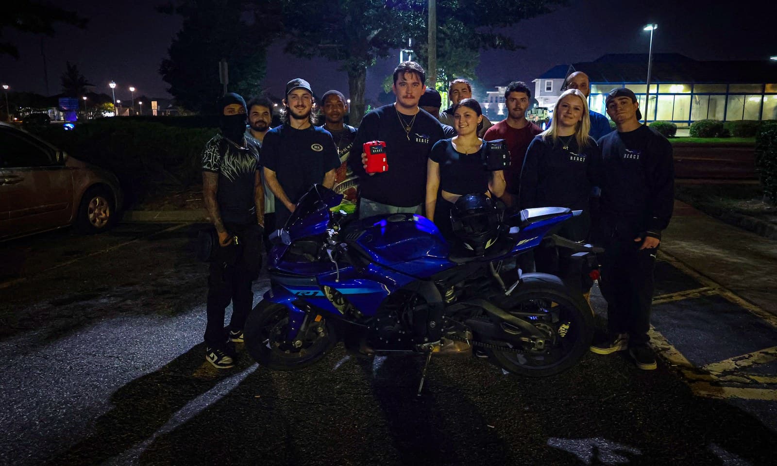 The R.E.A.C.T. community with a kit and their bike
